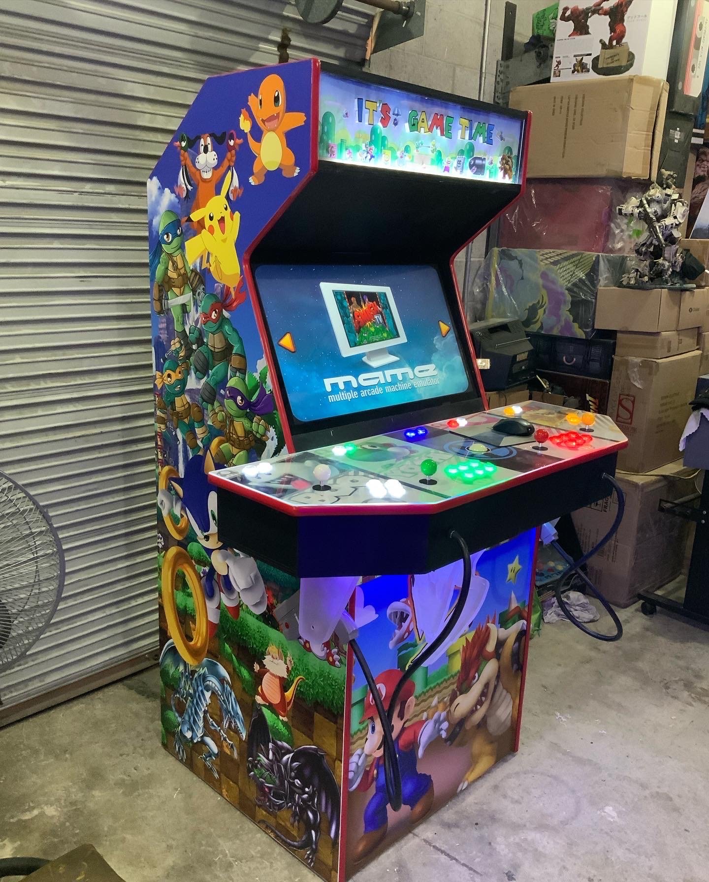 Slim wall-mounted arcade machine installed in a loft apartment