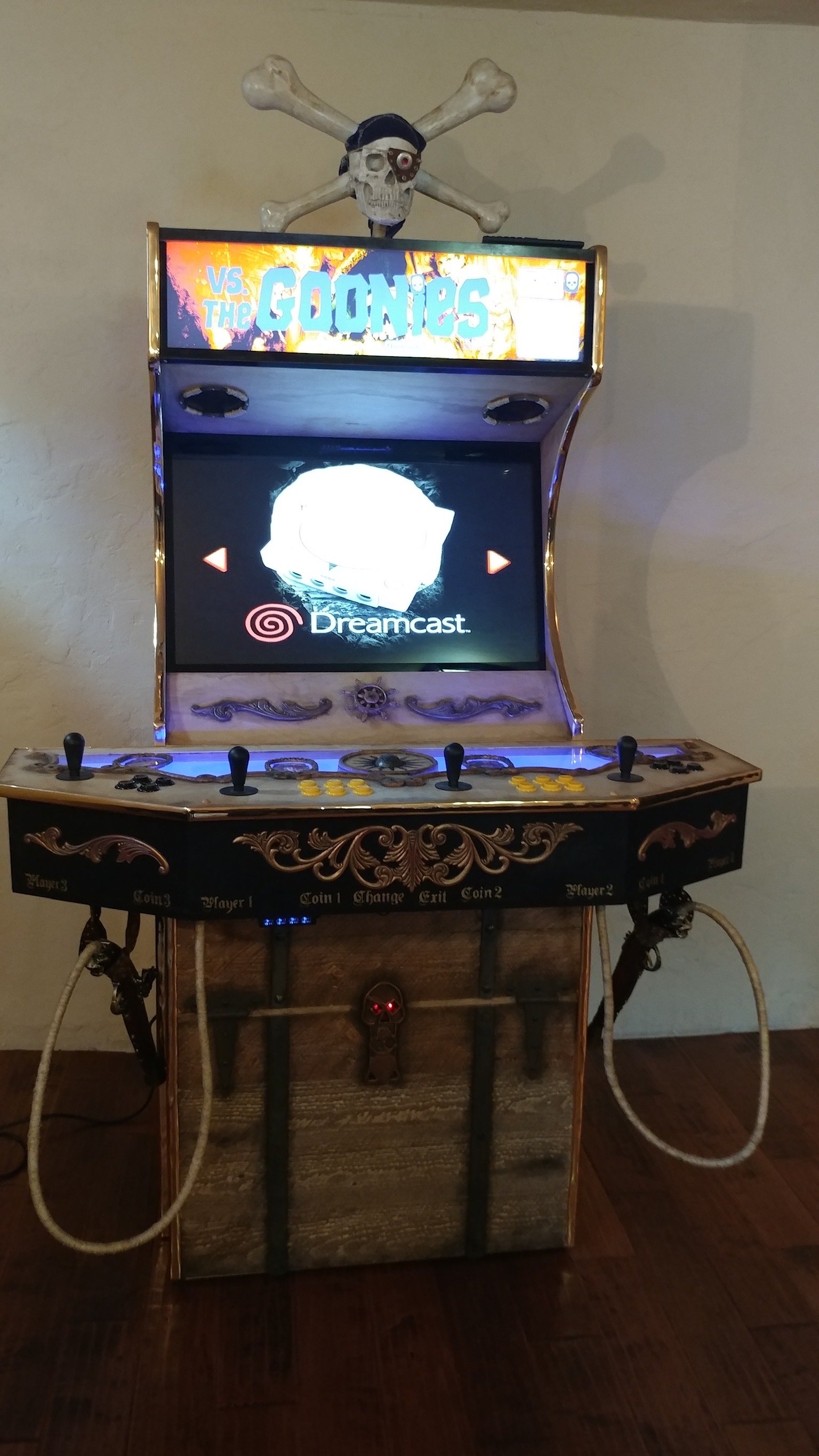 Arcade cabinet with synthwave-style custom vinyl wrap artwork